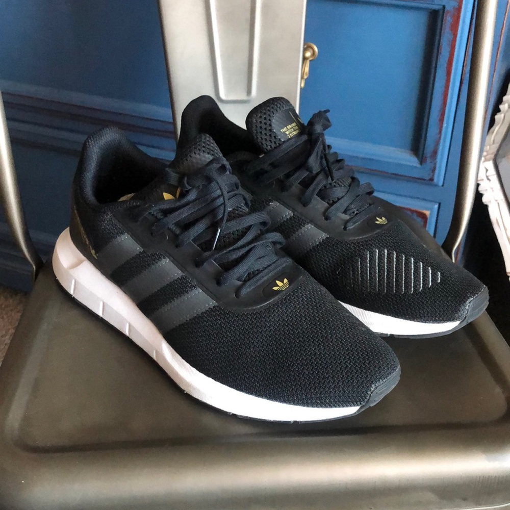 Black Adidas shoes.